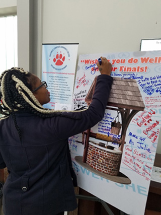 Students left several messages for their classmates on the poster for well-wishes.