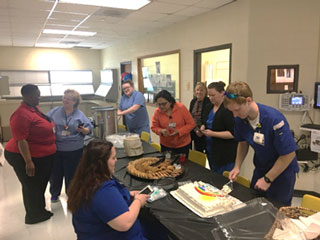 Faculty, staff, student and guests enjoy the open house reception.