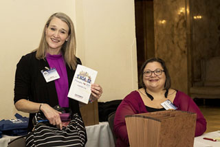 Department of Languages and Literature English Instructor Emily Ford and Associate Professor of English Margie Dernaika help conference organizers with registration and transportation.