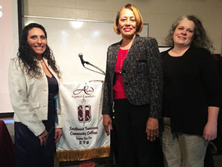 Outgoing ASL Chapter President Celeste Riley and President-elect Dana Warwick welcome Patterson.