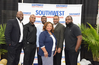 President Tracy D. Hall poses with members of the Underground band.  The group added an elegant touch to the event by playing classic hits and theme music throughout the ceremony.