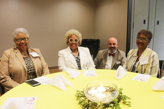 Languages and Literature adjunct instructor Cheryl Bingham, Business Administration, Accountancy, and Paralegal Studies Department Chair Brenda Smith, Dean of Faculty Jeremy Burnett, and Languages and Literature adjunct Cheryl Richmond mingle during the adjunct appreciation awards dinner.