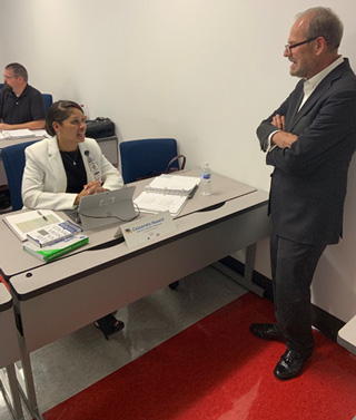 Dr. Cassandra Howard chats with Mid-South Quality Production Center Executive Director Donn Fisher during her Lean Six Sigma class.