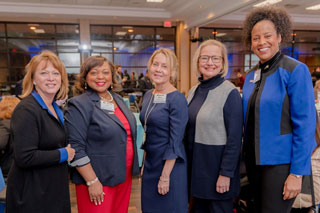 (l-r) Owner of Behind the Scenes Dusky Norsworthy, President Tracy D. Hall, Southwest Director of Community Programs & Engagement Suzanne Gibson, Southwest Foundation Board Chair Ann Langston and Executive Director of Communications and Marketing Daphne Thomas network at the cityCURRENT Signature Breakfast featuring Mick Ebeling and the Foundation as the Spotlight Charity.