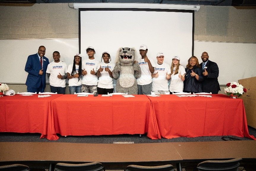 (L-R): Graduates from Millington High School sign letters of intent to commit to a career-tech education during National Signing Day for Career-Tech Students at the SWSC Open House and Career Fair. 