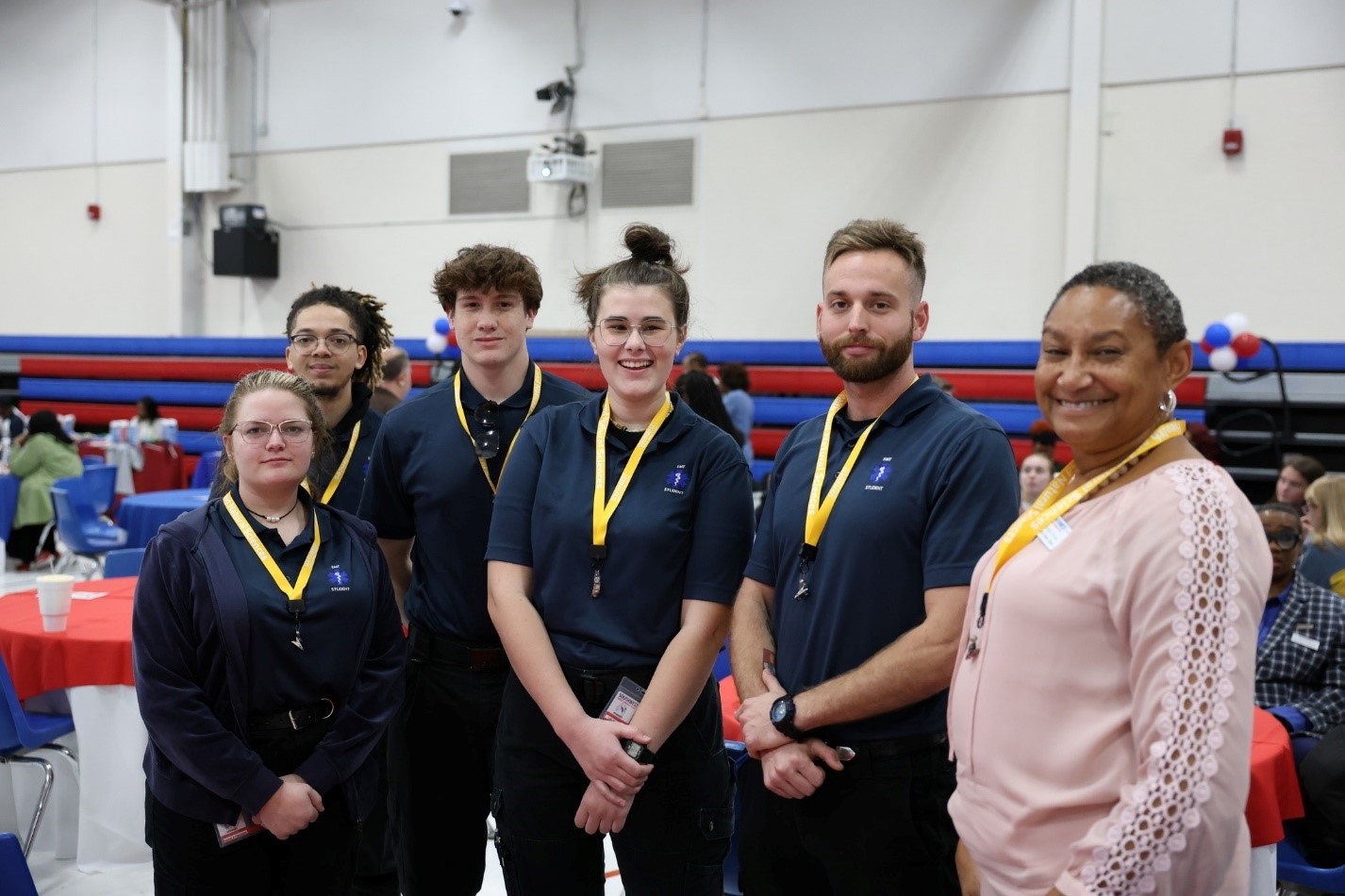 Dr. Sheila Bouie, dean of Health and Natural Sciences at right, pictured with first-time freshmen wearing their division’s lanyards. 