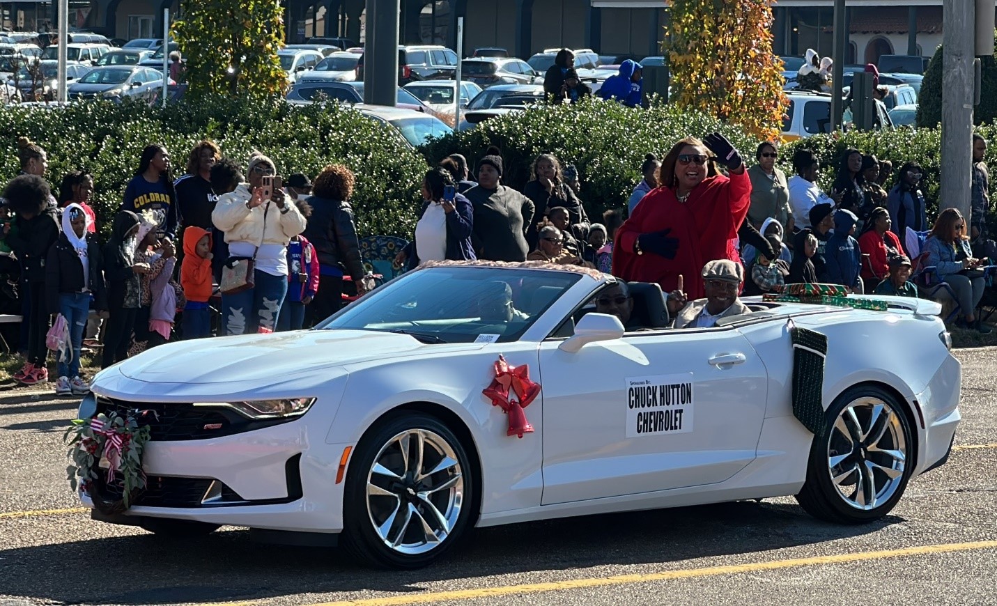 President Tracy D. Hall waves to the crowds as Grand Marshall of the Memphis Christmas Parade in Whitehaven. 