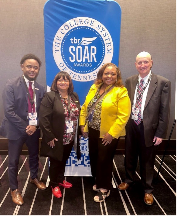 Pictured at the SOAR awards ceremony are Braylin Laster, Dr. Carol Ash, President Tracy D. Hall and Bill Summons.