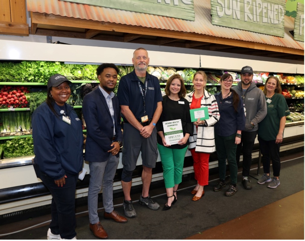 Sprouts Farmers Market employees and Southwest Community Community College staff members take a  photo at a grant donation ceremony on Sept.7, 2024.