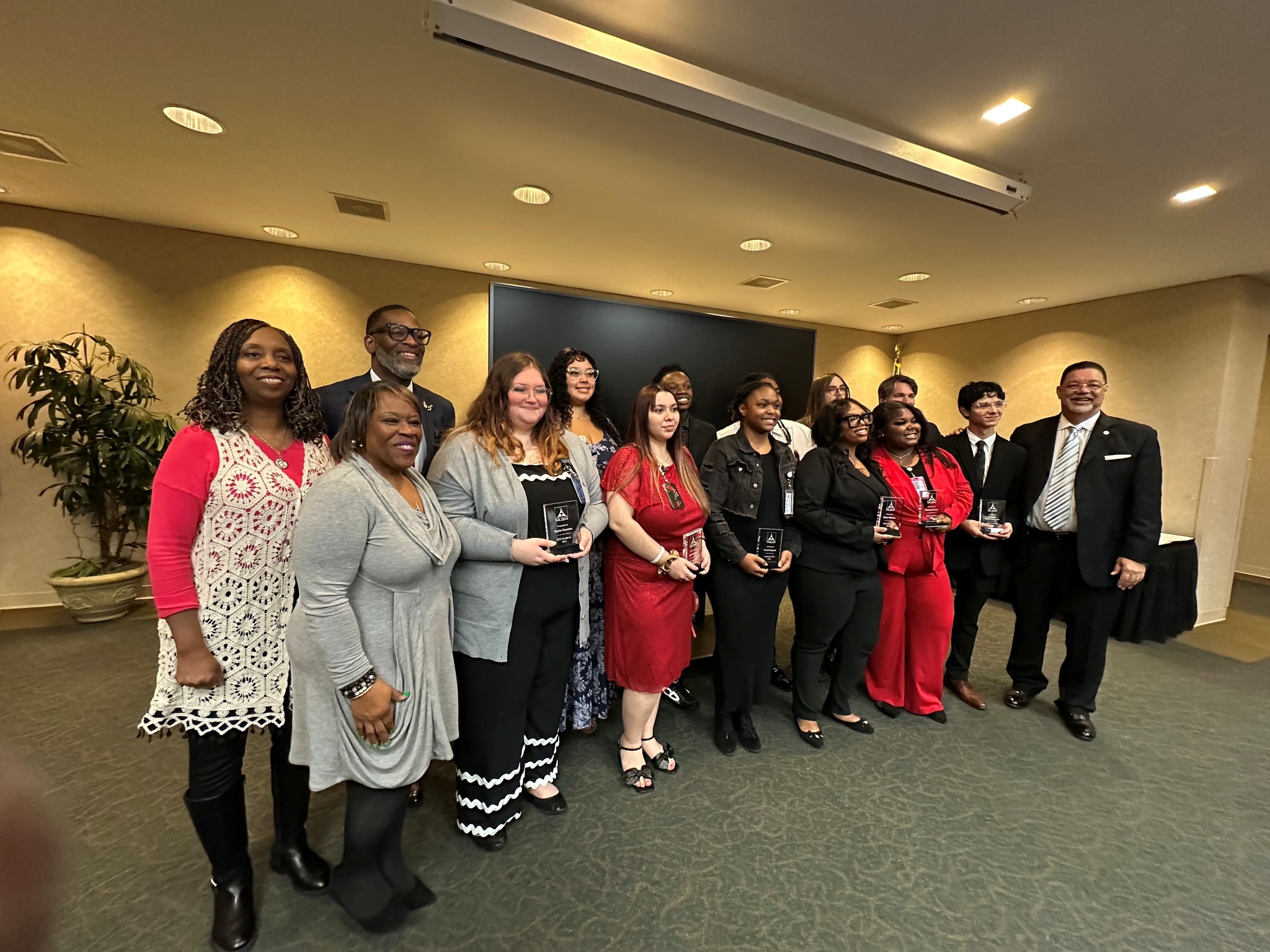 Students from the CEES Academy and their leaders pause for a graduation photo. 